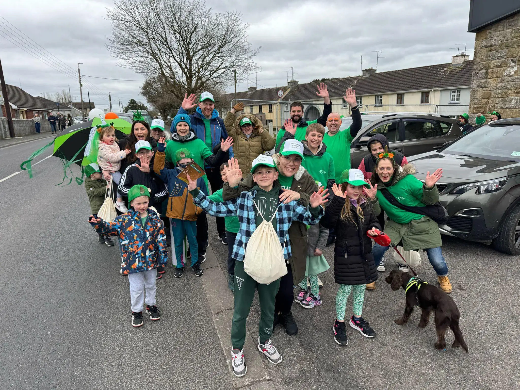 Belturbet Baptist Church community gathered together, waving and smiling